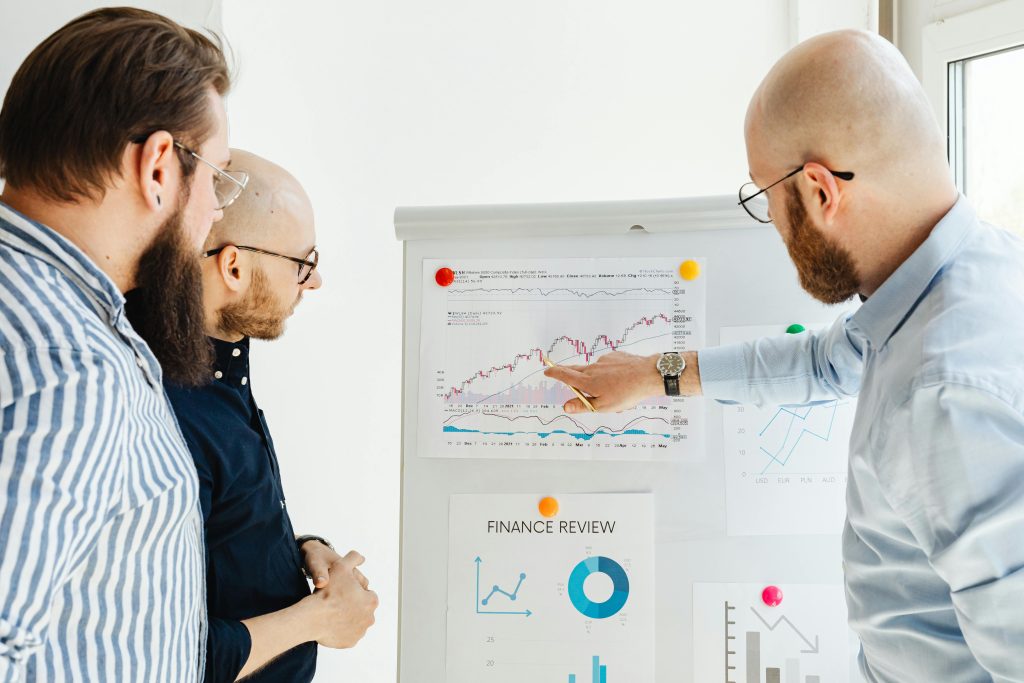 An illustrative image depicting a group of individuals collaborating on a data analysis project beyond the classroom in a dynamic, real-world setting. 